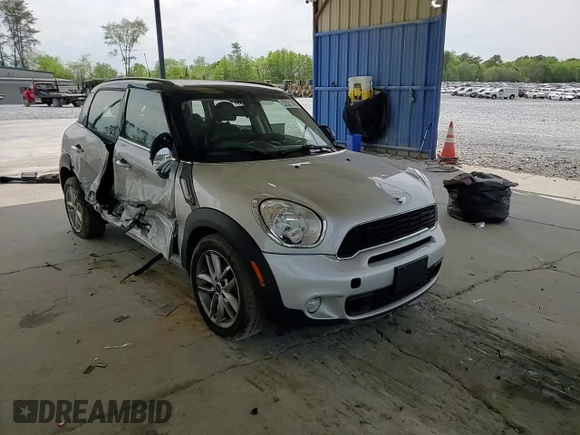 2014 MINI Countryman S with VIN WMWZC3C56EWP29211, listed as a Copart auction lot 52521145 with 91,396 mi miles and Salvage title. Bid and sale history available at DreamBid. Image 11.