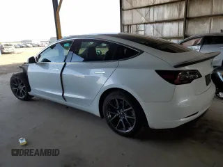 2020 Tesla Model 3 Standard Range Plus with VIN 5YJ3E1EA6LF645215, listed as a Copart auction lot 47882375 with 69,317 mi miles and Salvage Title. Bid and sale history available at DreamBid. Image 2.