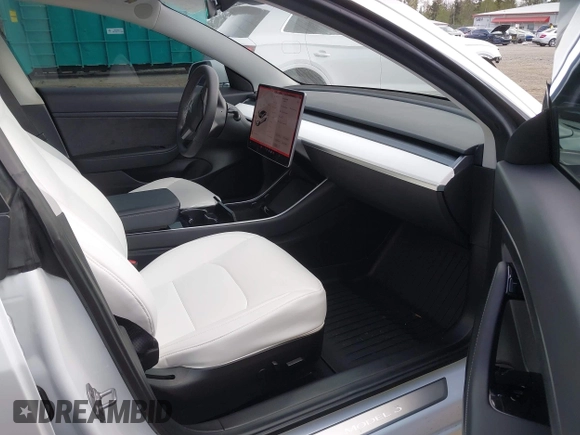 2020 Tesla Model 3 Standard Range Plus with VIN 5YJ3E1EA5LF613002, listed as a IAAI auction lot 42129085 with 55,672 mi miles. Bid and sale history available at carsss.com. Image 5.