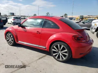 2014 Volkswagen Beetle Turbo R-Line with VIN 3VWVT7AT0EM656599, listed as a Copart auction lot 86358334 with 66,050 mi miles and Salvage Title. Bid and sale history available at DreamBid. Image 2.
