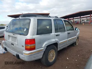1995 Jeep Grand Cherokee Limited with VIN 1J4GZ78Y3SC649231, listed as a IAAI auction lot 41763953 with 140,889 mi miles. Bid and sale history available at carsss.com. Image 4.