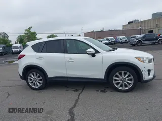 2015 Mazda CX-5 Grand Touring with VIN JM3KE4DY5F0530854, listed as a IAAI auction lot 42274582 with 144,732 mi miles and . Bid and sale history available at DreamBid. Image 13.