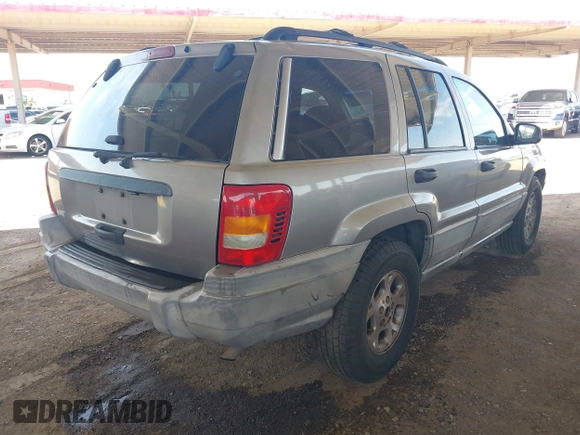 1999 Jeep Grand Cherokee Laredo with VIN 1J4G258S7XC679151, listed as a IAAI auction lot 42500706 with Not provided miles and . Bid and sale history available at DreamBid. Image 4.