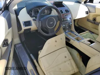 2015 Aston Martin DB9 z VIN SCFFDAFM3FGB16585, wystawiony jako Copart lot #76159354 z przebiegiem Nie podano mil oraz Szkody całkowita. Historia ofert i sprzedaży dostępna na DreamBid. Obrazek 8.