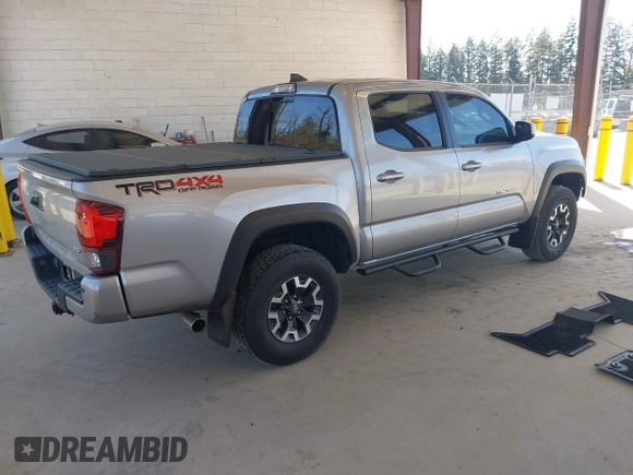 2018 Toyota Tacoma SR with VIN 3TMCZ5ANXJM146284, listed as a IAAI auction lot 42041525 with 103,143 mi miles and . Bid and sale history available at DreamBid. Image 4.