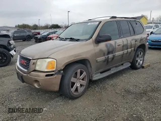 2003 GMC Envoy SLE with VIN 1GKDT13S432263407, listed as a Copart auction lot 44025825 with 154,266 mi miles and Salvage Title. Bid and sale history available at carsss.com. Image 1.