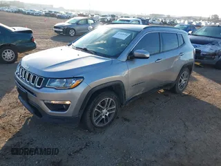 2019 Jeep Compass Altitude with VIN 3C4NJCBB0KT743606, listed as a IAAI auction lot 41468490 with 57,787 mi miles and . Bid and sale history available at DreamBid. Image 2.