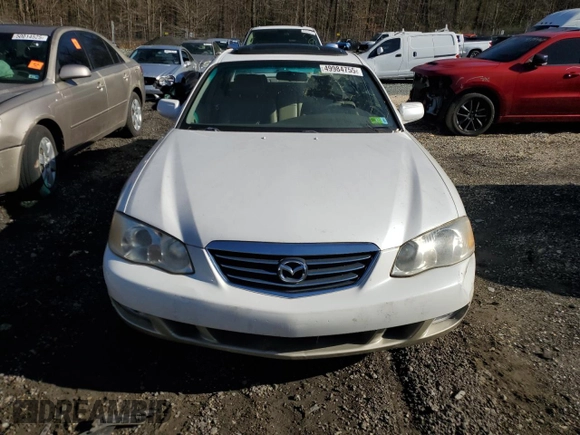 2002 Mazda Millenia S z VIN JM1TA222521733260, wystawiony jako Copart lot #49984755 z przebiegiem 140 212 mil mil oraz Szkoda całkowita • Salvage title. Historia ofert i sprzedaży dostępna na DreamBid. Obrazek 5.