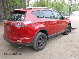 2016 Toyota RAV4 LE with VIN JTMZFREV4GJ062701, listed as a IAAI auction lot 42084694 with 121,553 mi miles and . Bid and sale history available at DreamBid. Image 4.