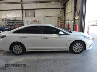 2016 Hyundai Sonata Hybrid SE with VIN KMHE24L15GA009241, listed as a IAAI auction lot 42083395 with 127,068 mi miles. Bid and sale history available at carsss.com. Image 13.