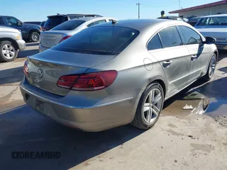 2014 Volkswagen CC Sport with VIN WVWBN7AN1EE518559, listed as a IAAI auction lot 41208853 with 154,957 mi miles. Bid and sale history available at carsss.com. Image 4.