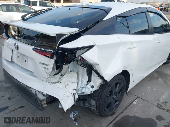2021 Toyota Prius L Eco z VIN JTDKAMFU9M3131228, wystawiony jako IAAI lot #41257117 z przebiegiem 72 840 mil mil oraz . Historia ofert i sprzedaży dostępna na DreamBid. Obrazek 6.