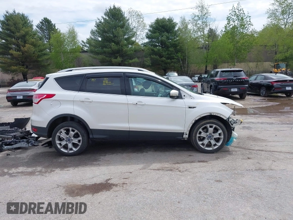 2016 Ford Escape Titanium with VIN 1FMCU9J98GUA00832, listed as a IAAI auction lot 42188941 with 90,764 mi miles and . Bid and sale history available at DreamBid. Image 13.