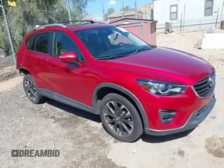 2016 Mazda CX-5 Grand Touring with VIN JM3KE2DY3G0686588, listed as a IAAI auction lot 41697312 with 65,090 mi miles. Bid and sale history available at carsss.com. Image 1.