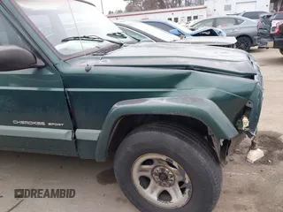 2000 Jeep Cherokee with VIN 1J4FT48S6YL102373, listed as a IAAI auction lot 41685817 with 214,106 mi miles and . Bid and sale history available at DreamBid. Image 13.
