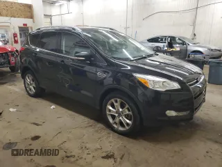 2015 Ford Escape Titanium with VIN 1FMCU9JX9FUA30970, listed as a Copart auction lot 41780275 with 106,114 mi miles and Salvage Title. Bid and sale history available at DreamBid. Image 4.