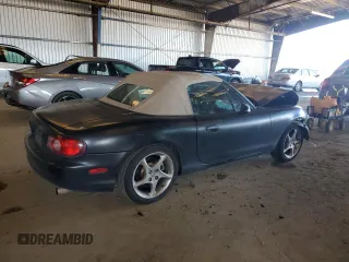 2003 Mazda MX-5 Miata Cloth with VIN JM1NB353730303334, listed as a Copart auction lot 51692615 with 142,789 mi miles and Salvage title. Bid and sale history available at DreamBid. Image 3.