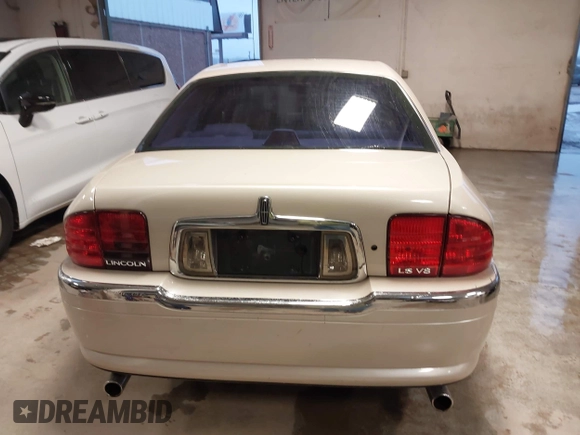 2002 Lincoln LS w/Base Pkg z VIN 1LNHM87AX2Y620293, wystawiony jako IAAI lot #41461349 z przebiegiem 129 295 mil mil oraz . Historia ofert i sprzedaży dostępna na DreamBid. Obrazek 16.