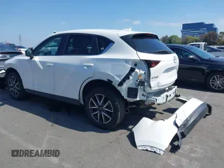 2018 Mazda CX-5 Touring with VIN JM3KFACM0J0416716, listed as a IAAI auction lot 42150121 with 61,332 mi miles and . Bid and sale history available at carsss.com. Image 3.