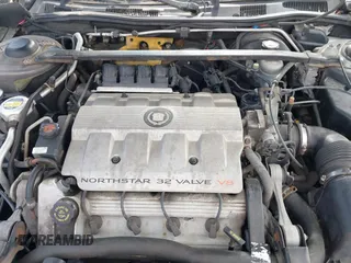 1999 Cadillac DeVille DHS z VIN 1G6KE54Y2XU752599, wystawiony jako IAAI lot #42141950 z przebiegiem 135 999 mil mil oraz . Historia ofert i sprzedaży dostępna na DreamBid. Obrazek 10.