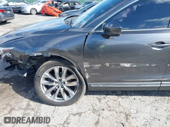 2019 Mazda CX-9 Signature with VIN JM3TCBEYXK0324257, listed as a IAAI auction lot 41986590 with Not provided miles and . Bid and sale history available at DreamBid. Image 6.