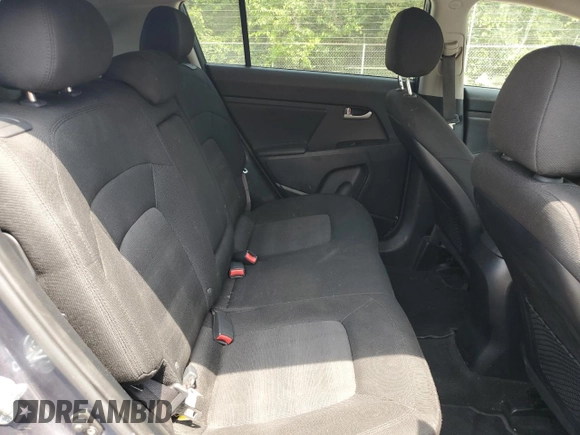 2012 Kia Sportage LX z VIN KNDPBCA27C7234285, wystawiony jako Copart lot #65807995 z przebiegiem 178 515 mil mil oraz Czysty tytuł • Clean title. Historia ofert i sprzedaży dostępna na DreamBid. Obrazek 11.