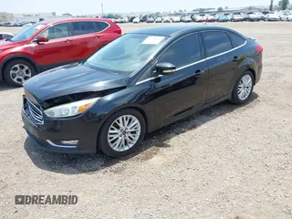 2016 Ford Focus Titanium z VIN 1FADP3J20GL310467, wystawiony jako IAAI lot #42478332 z przebiegiem 214 479 mil mil oraz . Historia ofert i sprzedaży dostępna na DreamBid. Obrazek 17.