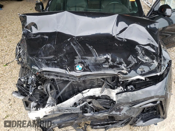 2020 BMW X7 M50i z VIN 5UXCX6C06LLE35455, wystawiony jako Copart lot #54965075 z przebiegiem Nie podano mil oraz Szkoda całkowita • Salvage title. Historia ofert i sprzedaży dostępna na DreamBid. Obrazek 12.