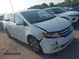 2016 Honda Odyssey Touring Elite with VIN 5FNRL5H95GB020612, listed as a IAAI auction lot 42704837 with 89,871 mi miles and . Bid and sale history available at DreamBid. Image 1.