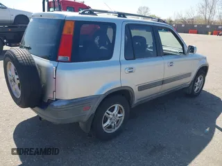 1999 Honda CR-V EX with VIN JHLRD1860XC056641, listed as a IAAI auction lot 42018329 with 321,707 mi miles. Bid and sale history available at carsss.com. Image 4.