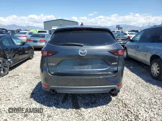 2018 Mazda CX-5 Touring z VIN JM3KFACM5J0338126, wystawiony jako Copart lot #56185795 z przebiegiem 115 254 mil mil oraz Szkoda całkowita • Salvage title. Historia ofert i sprzedaży dostępna na DreamBid. Obrazek 6.