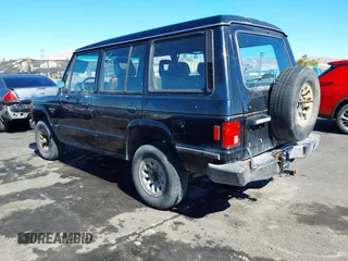 1990 Mitsubishi Montero z VIN JA4GJ51S9LJ002086, wystawiony jako IAAI lot #41643120 z przebiegiem 198 215 mil mil oraz . Historia ofert i sprzedaży dostępna na DreamBid. Obrazek 3.