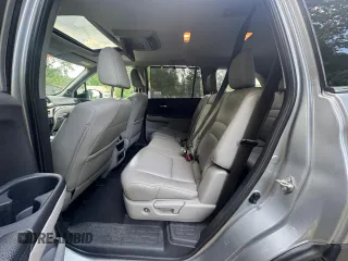 2018 Honda Pilot Touring z VIN 5FNYF6H94JB070661, wystawiony jako Copart lot #60926415 z przebiegiem 205 538 mil mil oraz Czysty tytuł • Clean title. Historia ofert i sprzedaży dostępna na DreamBid. Obrazek 11.