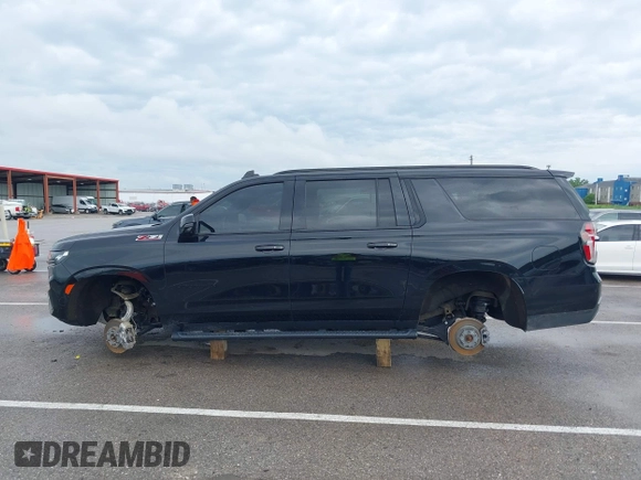 2022 Chevrolet Suburban Z71 with VIN 1GNSKDKD7NR151681, listed as a IAAI auction lot 41991670 with 57,090 mi miles and . Bid and sale history available at DreamBid. Image 14.