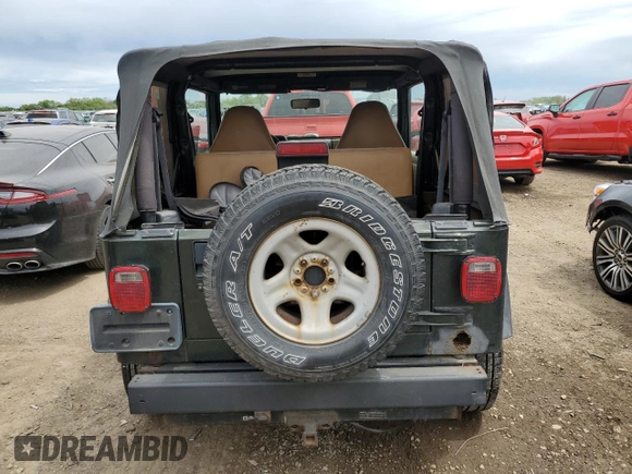 1998 Jeep Wrangler SE with VIN 1J4FY29P9WP767516, listed as a Copart auction lot 58149245 with 190,964 mi miles and Salvage title. Bid and sale history available at DreamBid. Image 6.