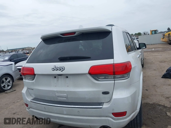 2014 Jeep Grand Cherokee Overland with VIN 1C4RJECG3EC266659, listed as a IAAI auction lot 41363419 with 142,896 mi miles. Bid and sale history available at carsss.com. Image 17.