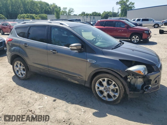 2015 Ford Escape Titanium with VIN 1FMCU9J92FUC74879, listed as a Copart auction lot 54683185 with 143,436 mi miles and Salvage title. Bid and sale history available at DreamBid. Image 4.