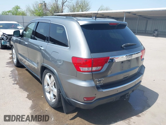 2013 Jeep Grand Cherokee Overland with VIN 1C4RJFCG2DC611877, listed as a IAAI auction lot 41910800 with 151,457 mi miles. Bid and sale history available at carsss.com. Image 3.