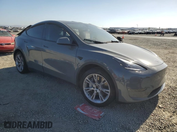 2024 Tesla Model Y Long Range with VIN 7SAYGDEE1RA245642, listed as a Copart auction lot 55490385 with Not provided miles and Salvage title. Bid and sale history available at DreamBid. Image 4.