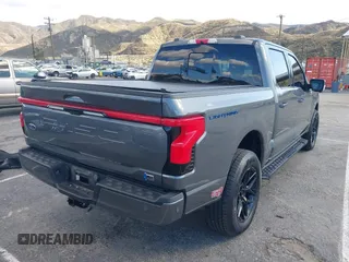 2023 Ford F-150 Lightning Pro with VIN 1FT6W1EV8PWG25191, listed as a IAAI auction lot 41716529 with 5,191 mi miles and . Bid and sale history available at DreamBid. Image 4.