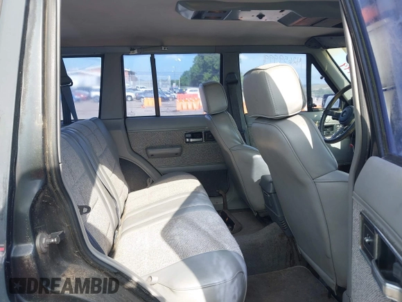 1991 Jeep Cherokee z VIN 1J4FJ58S6ML572036, wystawiony jako IAAI lot #42659999 z przebiegiem 200 845 mil mil oraz . Historia ofert i sprzedaży dostępna na DreamBid. Obrazek 8.