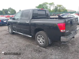 2011 Nissan Titan Pro-4X with VIN 1N6BA0ECXBN319157, listed as a IAAI auction lot 42456725 with 169,434 mi miles and . Bid and sale history available at DreamBid. Image 3.