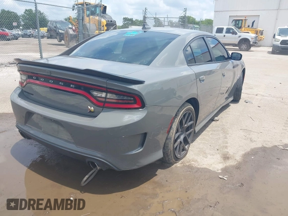 2019 Dodge Charger Scat Pack with VIN 2C3CDXGJ2KH633854, listed as a IAAI auction lot 42212517 with 74,285 mi miles and . Bid and sale history available at DreamBid. Image 4.