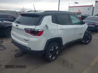 2018 Jeep Compass Trailhawk with VIN 3C4NJDDB9JT174899, listed as a IAAI auction lot 41635784 with 124,656 mi miles and . Bid and sale history available at DreamBid. Image 4.