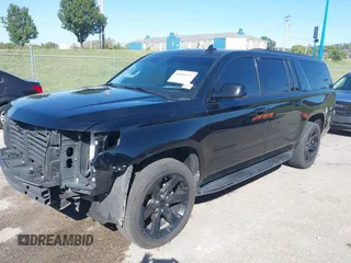 2019 Chevrolet Suburban Premier with VIN 1GNSKJKJ1KR100936, listed as a IAAI auction lot 40489121 with 97,884 mi miles and . Bid and sale history available at DreamBid. Image 2.