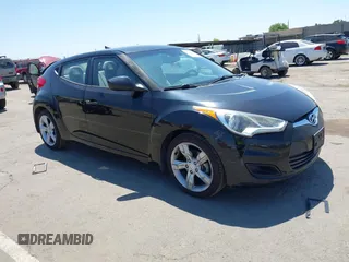 2013 Hyundai Veloster w/Black Int with VIN KMHTC6AD2DU144376, listed as a IAAI auction lot 42720882 with 143,023 mi miles and . Bid and sale history available at DreamBid. Image 1.