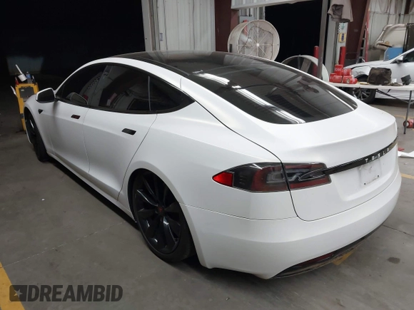 2017 Tesla Model S 100D z VIN 5YJSA1E2XHF224671, wystawiony jako IAAI lot #42665581 z przebiegiem 128 517 mil mil oraz . Historia ofert i sprzedaży dostępna na DreamBid. Obrazek 3.
