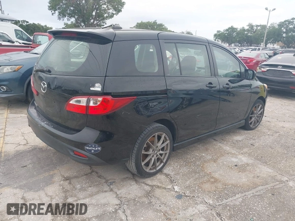2012 Mazda 5 Grand Touring with VIN JM1CW2DL9C0134697, listed as a IAAI auction lot 41976481 with 224,946 mi miles. Bid and sale history available at carsss.com. Image 4.