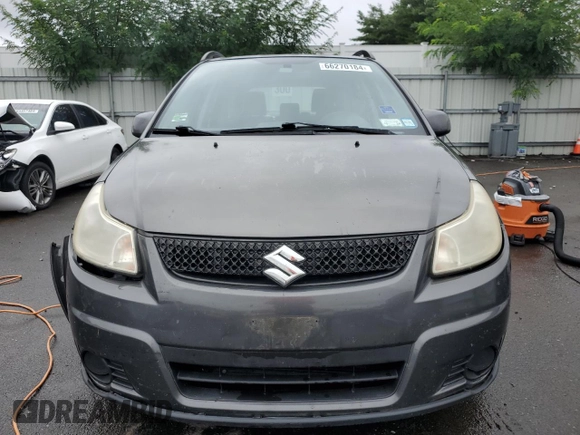 2011 Suzuki SX4 Crossover with VIN JS2YB5A30B6302560, listed as a Copart auction lot 66270184 with 137,913 mi miles and Salvage Title. Bid and sale history available at carsss.com. Image 5.