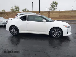 2014 Scion tC z VIN JTKJF5C77E3080128, wystawiony jako IAAI lot #42174898 z przebiegiem Nie podano mil oraz . Historia ofert i sprzedaży dostępna na DreamBid. Obrazek 13.